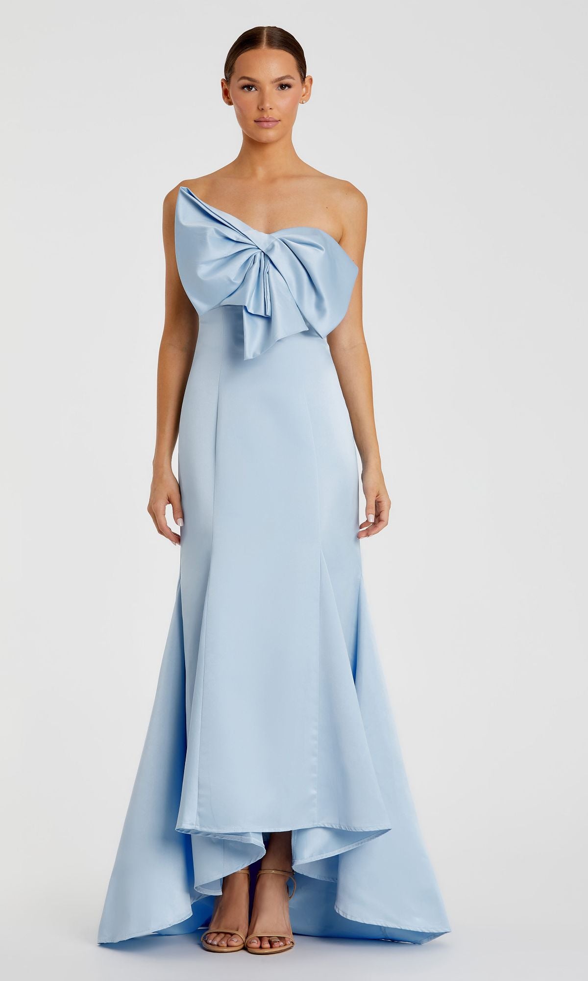 A woman wears the Mac Duggal 49701 Strapless Mermaid Formal Dress, featuring a floor-length silhouette and paired with nude heels.